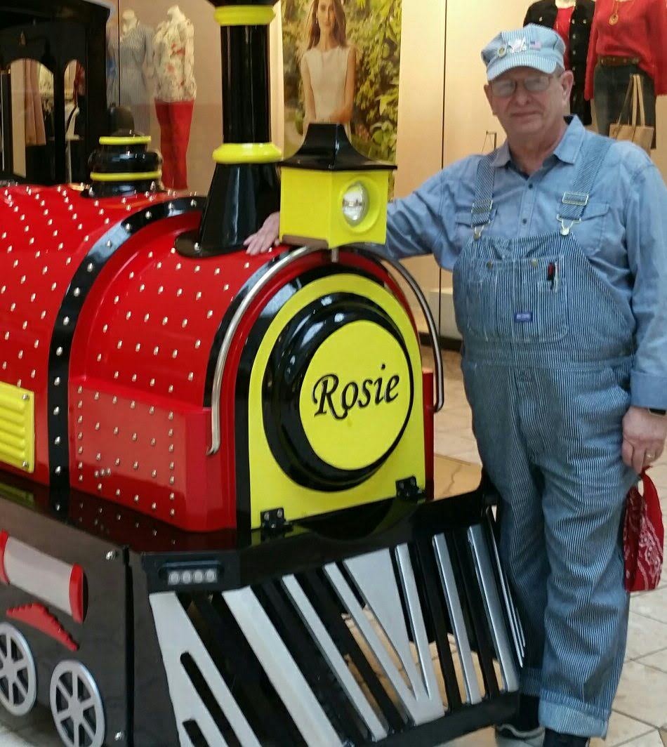 An All Smiles Aboard conductor at the mall